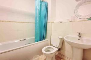 a bathroom with a toilet and a sink at Entire Home in East London E3 near Bromley By Bow Station in London