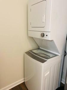 a white coffee machine with a microwave on top of it at The Grayson Home 3 bedroom 1 bath in New Albany