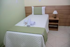 Кровать или кровати в номере Domus Hotel Palmeiras - Canaã dos Carajás