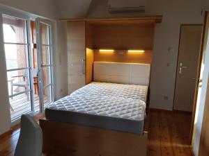 Voodi või voodid majutusasutuse Chalet-Südsteiermark - traumhafte Aussicht, Infinity Pool, Privatsphäre, Klima und de-luxe Ausstattung toas