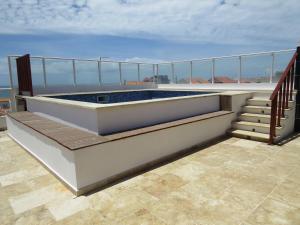 a hot tub on the deck of a balcony at Ocean Roof in Santa Maria