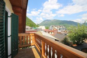 a balcony with a view of a town and mountains at Wohnung Rudolf in Bad Ischl