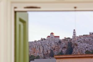 a view of a mountain with buildings on it at Grandma's House in Kalymnos