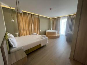 A bed or beds in a room at SACA HOTEL