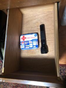 a remote control in a wooden drawer with a box at Studio with private bath room in Chicago