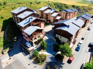 an aerial view of a city with buildings at Appartement chaleureux à 300m des pistes, 5 personnes, balcon, draps, parking - FR-1-508-228 in Lanslebourg-Mont-Cenis