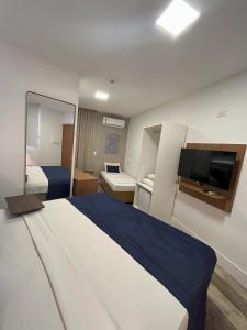 Leblon Design Hotel客房内的一张或多张床位