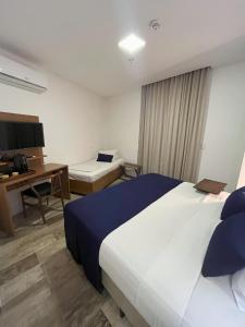 Leblon Design Hotel客房内的一张或多张床位