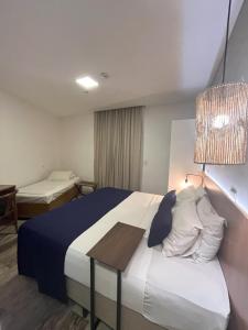 Leblon Design Hotel客房内的一张或多张床位