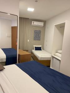 Leblon Design Hotel客房内的一张或多张床位