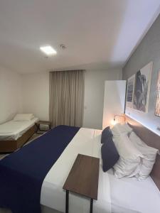 Leblon Design Hotel客房内的一张或多张床位