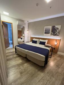 Leblon Design Hotel客房内的一张或多张床位