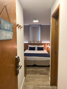 Leblon Design Hotel客房内的一张或多张床位