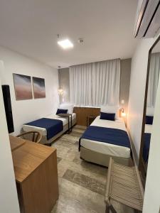 Leblon Design Hotel客房内的一张或多张床位