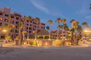 a resort at night with palm trees and buildings at Marina Pinacate A-520 in Puerto Peñasco