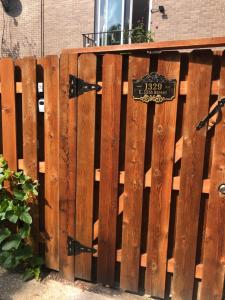 a wooden fence with a sign on it at Studio with private bath room in Chicago