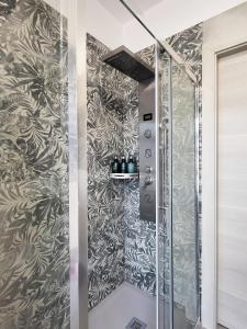 a shower in a bathroom with a wall at Casa Lariana in Lecco