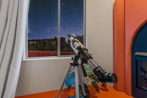 a telescope in a room with a view of the stars at Sedona Family Vacation in Sedona