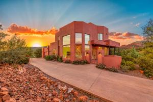 a building with a sunset in the background at Sedona Family Vacation in Sedona