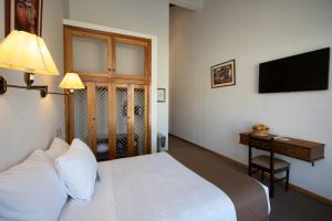 Postelja oz. postelje v sobi nastanitve DM Hoteles Cusco