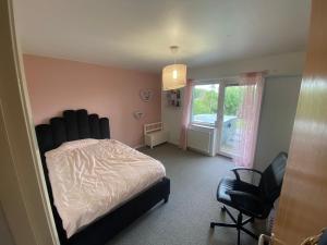 a bedroom with a bed and a window and a chair at Swden Sunne in Sunne +15 photos