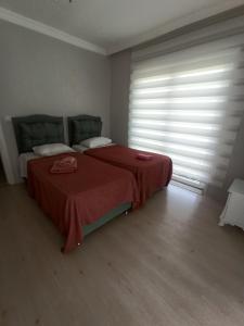 Postel nebo postele na pokoji v ubytování Grandvadi Villa kapalı ısıtmalı havuz