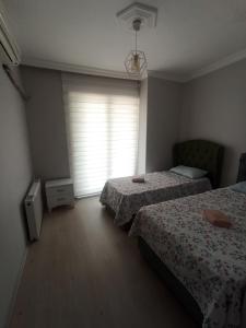 Postel nebo postele na pokoji v ubytování Grandvadi Villa kapalı ısıtmalı havuz