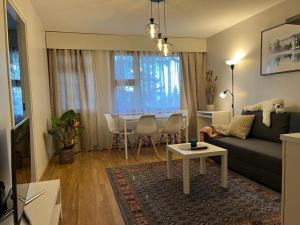 a living room with a couch and a table at APt 37 in Rovaniemi