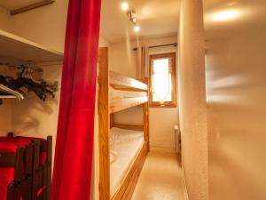 a room with two bunk beds and a window at Appartement Morillon 1100, 2 pièces, 5 personnes - FR-1-642-45 in Morillon