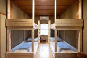 two bunk beds in a room with a hallway at Setouchi base - Vacation STAY 48109v in Mitoyo