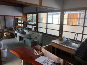 a kitchen with a sink and some windows at Setouchi base - Vacation STAY 48109v in Mitoyo