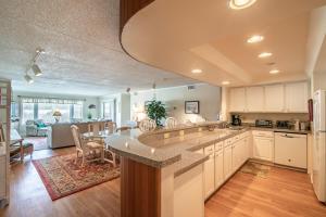 a kitchen with a large island in the middle at 5732 - Beach Music in Nags Head