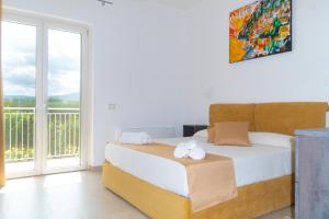 Postel nebo postele na pokoji v ubytování Biancolivo Country House
