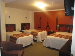 Postel nebo postele na pokoji v ubytování Hotel Novalux