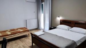 Postel nebo postele na pokoji v ubytování Dimora Rudiae Lecce