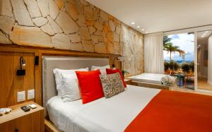 Cama ou camas em um quarto em Pousada Bahia Tambor