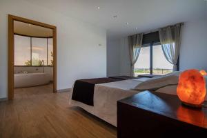 Posteľ alebo postele v izbe v ubytovaní Villa de vacaciones con encanto El Serrat