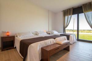 Posteľ alebo postele v izbe v ubytovaní Villa de vacaciones con encanto El Serrat