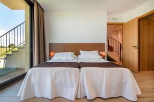 Posteľ alebo postele v izbe v ubytovaní Villa de vacaciones con encanto El Serrat