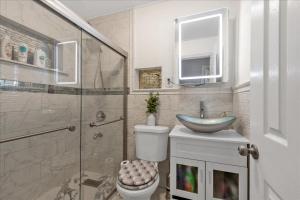 a bathroom with a toilet and a sink and a shower at Brooklyn Double Decker in Brooklyn +21 photos