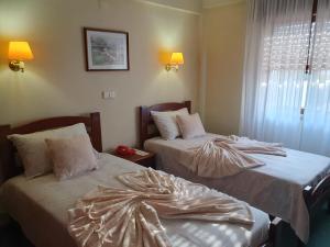 Postel nebo postele na pokoji v ubytování Hotel Peninsular
