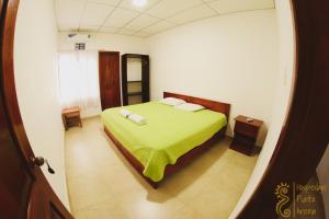 Voodi või voodid majutusasutuse Hostal Punta Arena toas