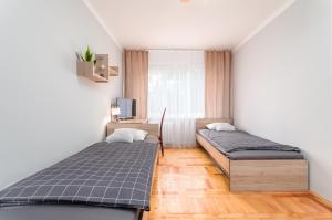 Postel nebo postele na pokoji v ubytování Two Bedrooms Apartment FAKTURA FAST CHECK-IN 24H