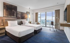 Cama o camas de una habitación en Hilton Auckland