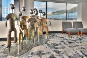 a group ofulptured animals on display in a room at Hilton Orlando/Altamonte Springs in Orlando