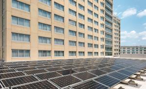 a building with solar panels in front of a building at Hilton Baltimore BWI Airport in Linthicum Heights