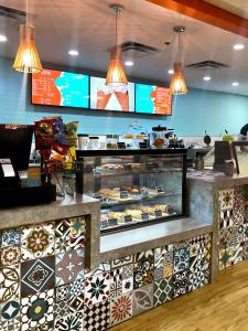 a bakery with a counter with many different types of pastries at Caribe Hilton in San Juan