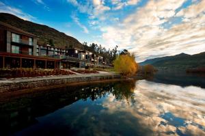 a view of a river in front of a building at Hilton Queenstown Resort & Spa in Queenstown