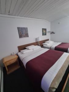 Postel nebo postele na pokoji v ubytování Sundowner Motel + 25 fotografií