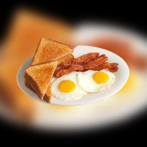 a white plate with eggs bacon and toast at Oasis Village Fenfushi, Maldives in Fenfushi